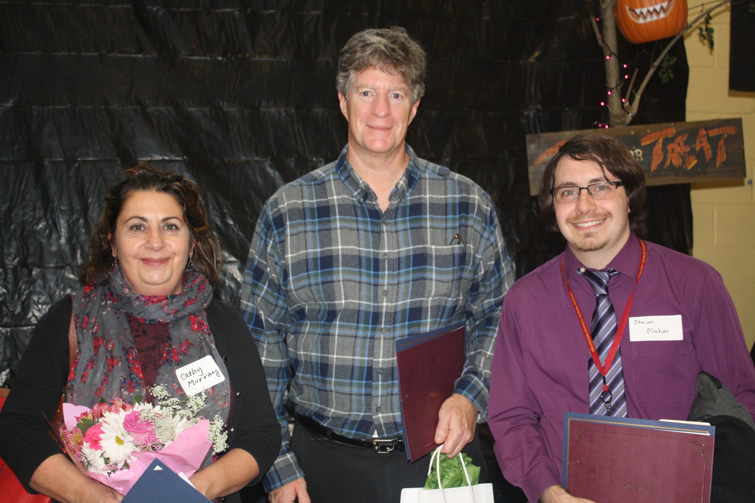 photo of three teachers with certificates